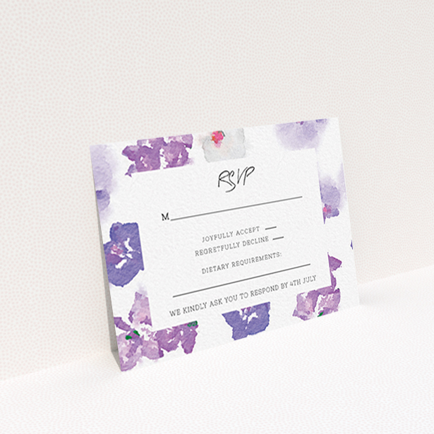 A wedding rsvp card named "Violet Explosion". It is an A7 card in a landscape orientation. "Violet Explosion" is available as a flat card, with mainly purple/dark pink colouring.