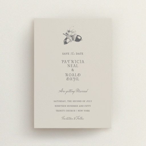 A wedding save the date design named "Acorn stamp". It is an A6 save the date in a portrait orientation. "Acorn stamp" is available as a flat save the date, with mainly dark cream colouring.
