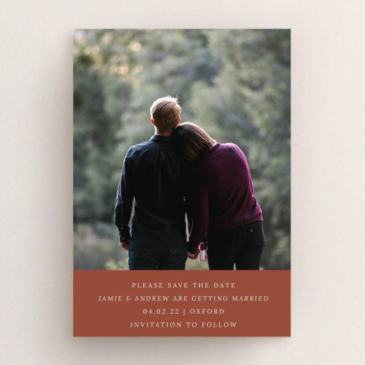 A wedding save the date design titled "Autumnal Photo". It is an A5 save the date in a portrait orientation. It is a photographic wedding save the date with room for 1 photo. "Autumnal Photo" is available as a flat save the date, with mainly dark orange colouring.