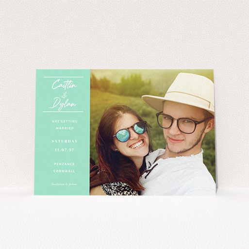A wedding save the date called "Bit on the side". It is an A6 save the date in a landscape orientation. It is a photographic wedding save the date with room for 1 photo. "Bit on the side" is available as a flat save the date, with tones of green and white.