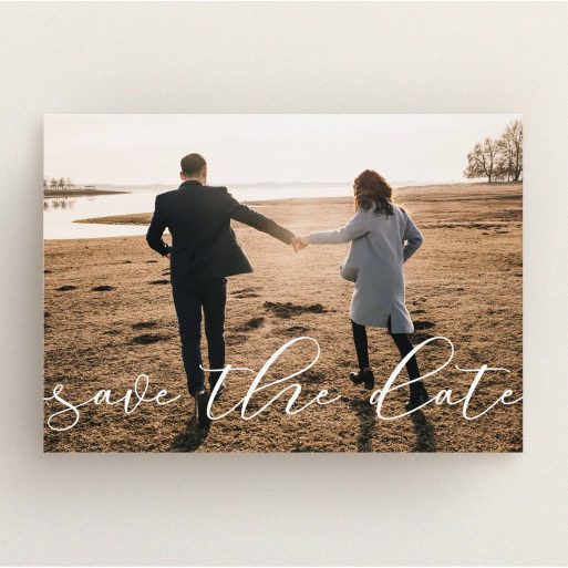 A wedding save the date card design named "Across the Photo". It is an A5 card in a landscape orientation. It is a photographic wedding save the date card with room for 1 photo. "Across the Photo" is available as a flat card, with mainly white colouring.