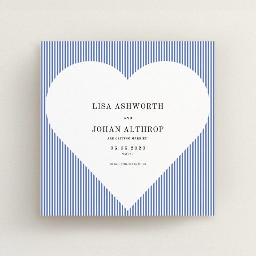A wedding save the date card called "Between the Lines". It is a square (148mm x 148mm) card in a square orientation. "Between the Lines" is available as a flat card, with tones of blue and white.