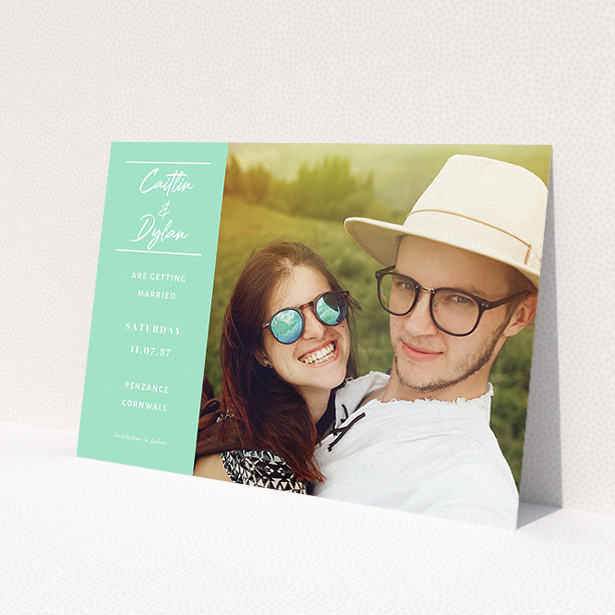 A wedding save the date card template titled 'Bit on the side'. It is an A5 card in a landscape orientation. It is a photographic wedding save the date card with room for 1 photo. 'Bit on the side' is available as a flat card, with tones of green and white.