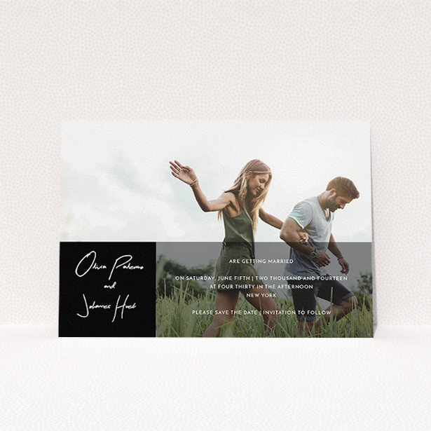 A wedding save the date card design called "Black on black". It is an A5 card in a landscape orientation. It is a photographic wedding save the date card with room for 1 photo. "Black on black" is available as a flat card, with tones of black and white.