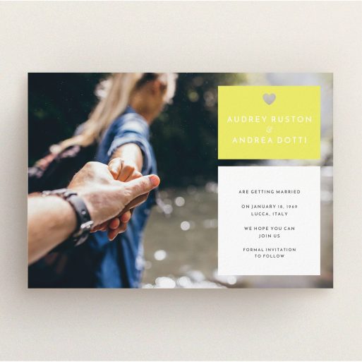 A wedding save the date card design named "Boxed In". It is an A5 card in a landscape orientation. It is a photographic wedding save the date card with room for 1 photo. "Boxed In" is available as a flat card, with mainly yellow colouring.
