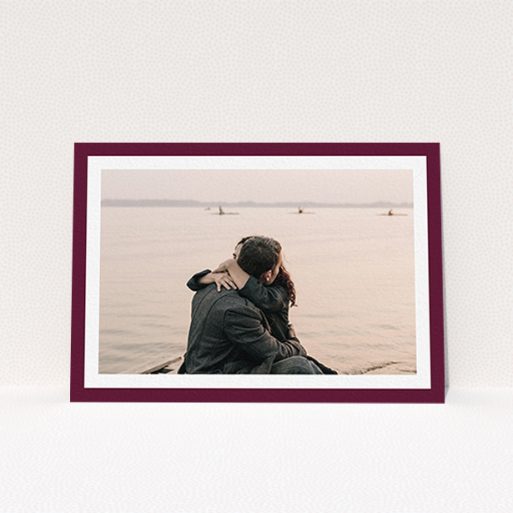 A wedding save the date card design named "Classic Burgundy Photo Frame". It is an A6 card in a landscape orientation. It is a photographic wedding save the date card with room for 1 photo. "Classic Burgundy Photo Frame" is available as a flat card, with tones of burgundy and white.