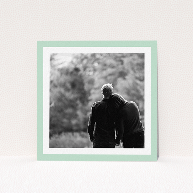 A wedding save the date card called "Classic Mint Photo Frame". It is a square (148mm x 148mm) card in a square orientation. It is a photographic wedding save the date card with room for 1 photo. "Classic Mint Photo Frame" is available as a flat card, with tones of green and white.
