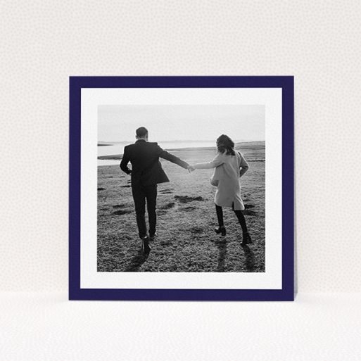 A wedding save the date card design named "Classic Navy Photo Frame". It is a square (148mm x 148mm) card in a square orientation. It is a photographic wedding save the date card with room for 1 photo. "Classic Navy Photo Frame" is available as a flat card, with tones of blue and white.