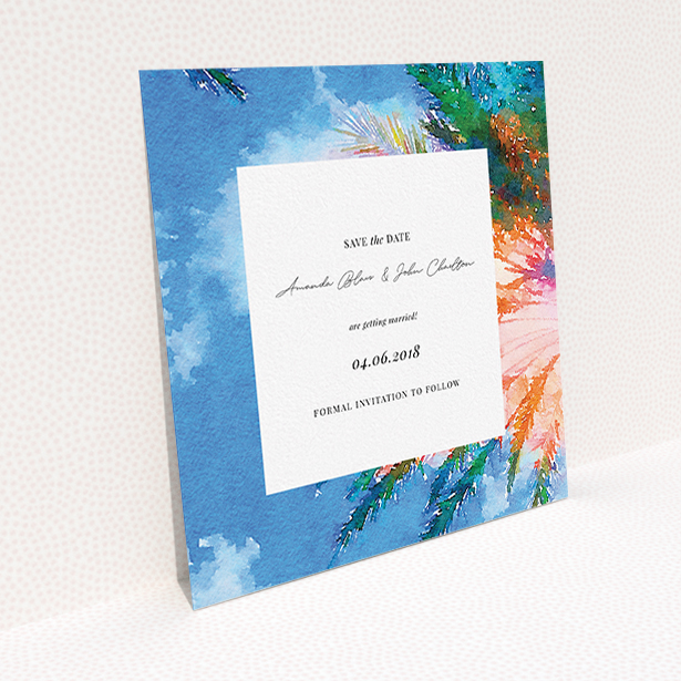 A wedding save the date card design titled "From the Sunbed". It is a square (148mm x 148mm) card in a square orientation. "From the Sunbed" is available as a flat card, with tones of sky blue and green.