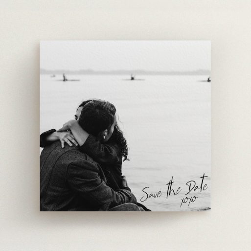 A wedding save the date card design called "Full Page Photo Square". It is a square (148mm x 148mm) card in a square orientation. It is a photographic wedding save the date card with room for 1 photo. "Full Page Photo Square" is available as a flat card, with mainly black colouring.