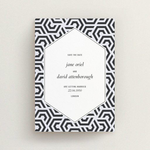 A wedding save the date card called "Geometric corners". It is an A6 card in a portrait orientation. "Geometric corners" is available as a flat card, with mainly blue colouring.