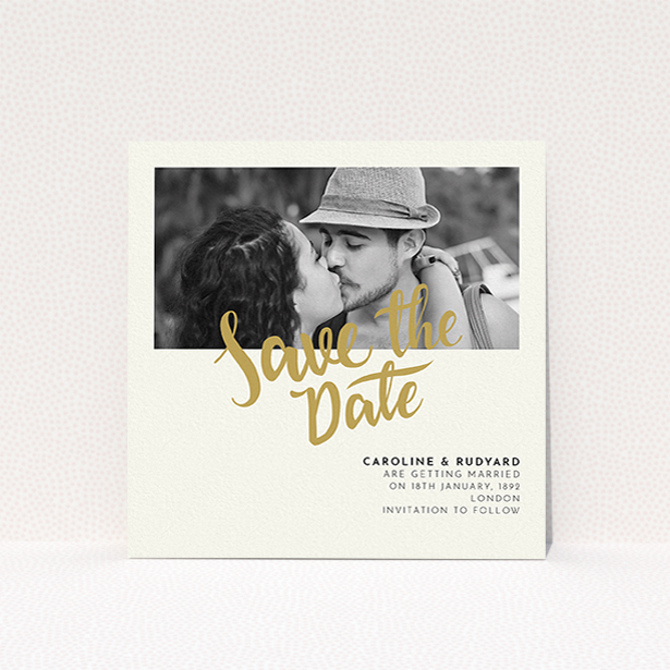 A wedding save the date card design named "Gold Typography Photo". It is a square (148mm x 148mm) card in a square orientation. It is a photographic wedding save the date card with room for 1 photo. "Gold Typography Photo" is available as a flat card, with tones of cream and gold.