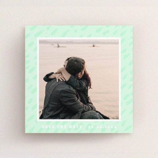 A wedding save the date card design named "Green Photo Frame". It is a square (148mm x 148mm) card in a square orientation. It is a photographic wedding save the date card with room for 1 photo. "Green Photo Frame" is available as a flat card, with tones of green and white.