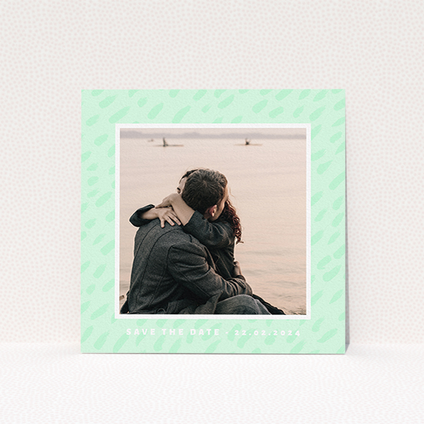 A wedding save the date card design named "Green Photo Frame". It is a square (148mm x 148mm) card in a square orientation. It is a photographic wedding save the date card with room for 1 photo. "Green Photo Frame" is available as a flat card, with tones of green and white.