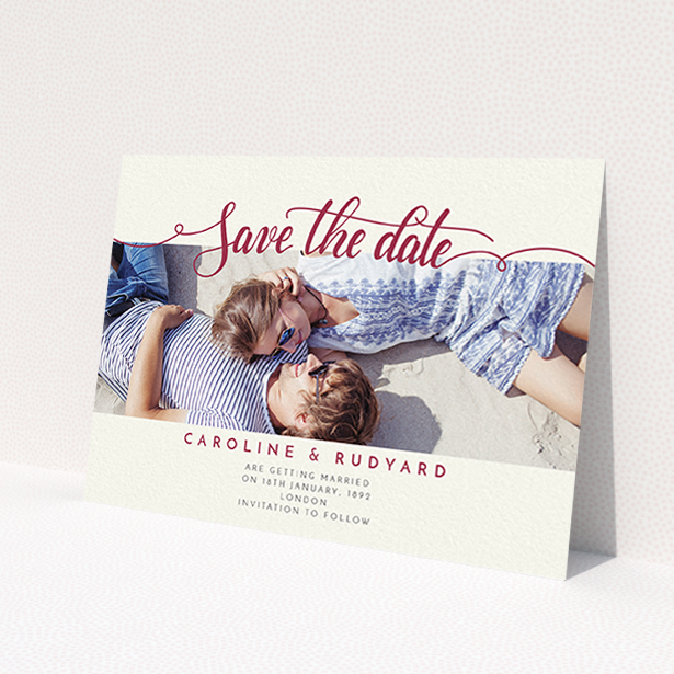 A wedding save the date card design called 'Landscape Curly Typography'. It is an A6 card in a landscape orientation. It is a photographic wedding save the date card with room for 1 photo. 'Landscape Curly Typography' is available as a flat card, with tones of pale cream and red.