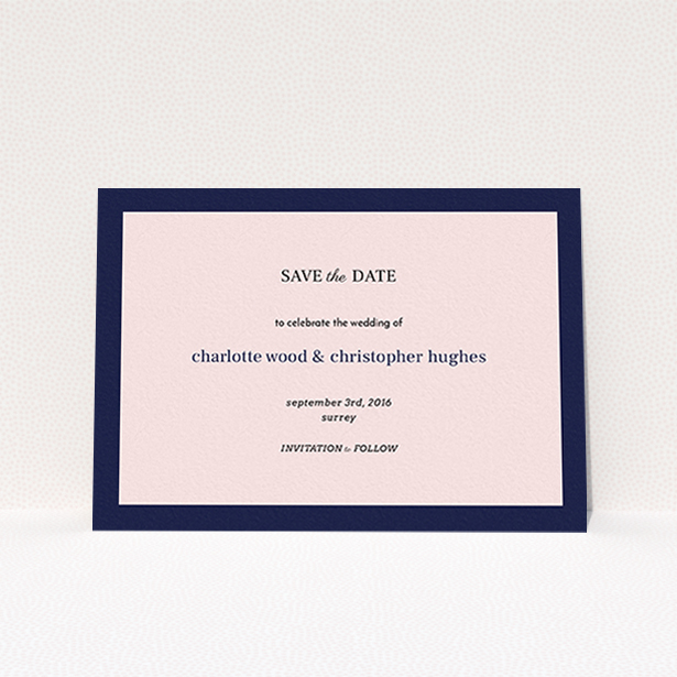 A wedding save the date card design named "Laydown simple". It is an A6 card in a landscape orientation. "Laydown simple" is available as a flat card, with tones of pink and navy blue.