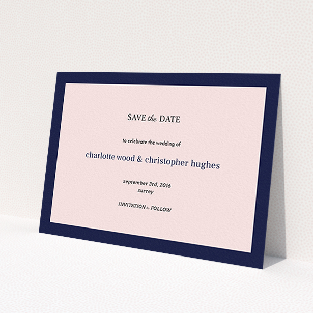 A wedding save the date card design named "Laydown simple". It is an A6 card in a landscape orientation. "Laydown simple" is available as a flat card, with tones of pink and navy blue.