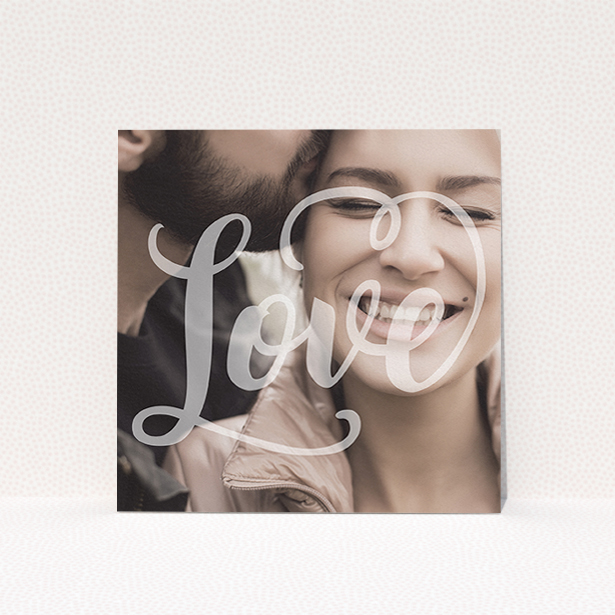 A wedding save the date card template titled "Light Typography". It is a square (148mm x 148mm) card in a square orientation. It is a photographic wedding save the date card with room for 1 photo. "Light Typography" is available as a flat card, with mainly white colouring.