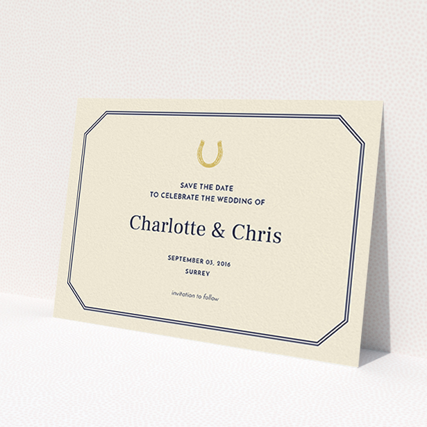 A wedding save the date card design called "Lucky horse shoe". It is an A6 card in a landscape orientation. "Lucky horse shoe" is available as a flat card, with tones of cream and gold.