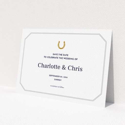 A wedding save the date card named 'Lucky horse shoe'. It is an A6 card in a landscape orientation. 'Lucky horse shoe' is available as a flat card, with tones of white and grey.