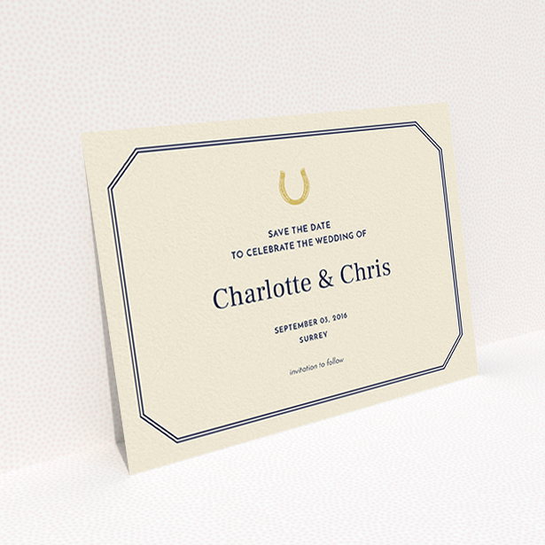 A wedding save the date card design called "Lucky horse shoe". It is an A6 card in a landscape orientation. "Lucky horse shoe" is available as a flat card, with tones of cream and gold.