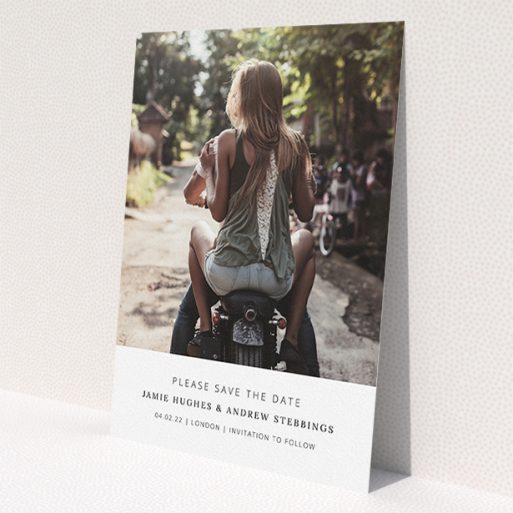 A wedding save the date card named 'Maddox Street'. It is an A5 card in a portrait orientation. It is a photographic wedding save the date card with room for 1 photo. 'Maddox Street' is available as a flat card, with mainly white colouring.
