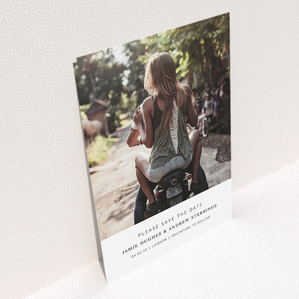 A wedding save the date card named "Maddox Street". It is an A5 card in a portrait orientation. It is a photographic wedding save the date card with room for 1 photo. "Maddox Street" is available as a flat card, with mainly white colouring.