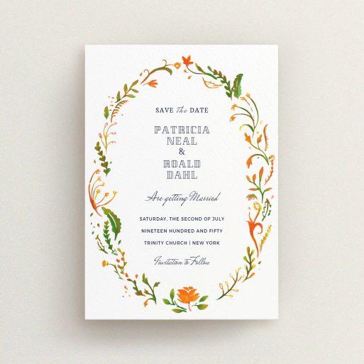A wedding save the date card named "Midsummer Wreath". It is an A6 card in a portrait orientation. "Midsummer Wreath" is available as a flat card, with tones of orange, green and yellow.