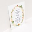 A wedding save the date card named "Midsummer Wreath". It is an A6 card in a portrait orientation. "Midsummer Wreath" is available as a flat card, with tones of orange, green and yellow.
