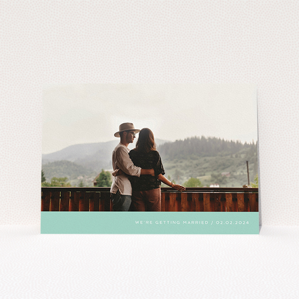 A wedding save the date card called "Mint Bottom Simple". It is an A5 card in a landscape orientation. It is a photographic wedding save the date card with room for 1 photo. "Mint Bottom Simple" is available as a flat card, with tones of green and white.