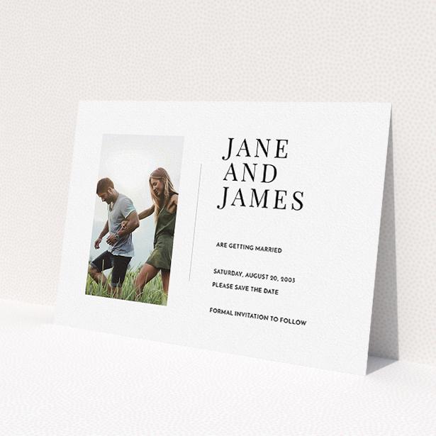 A wedding save the date card design called "Modern postcard". It is an A5 card in a landscape orientation. It is a photographic wedding save the date card with room for 1 photo. "Modern postcard" is available as a flat card, with mainly white colouring.