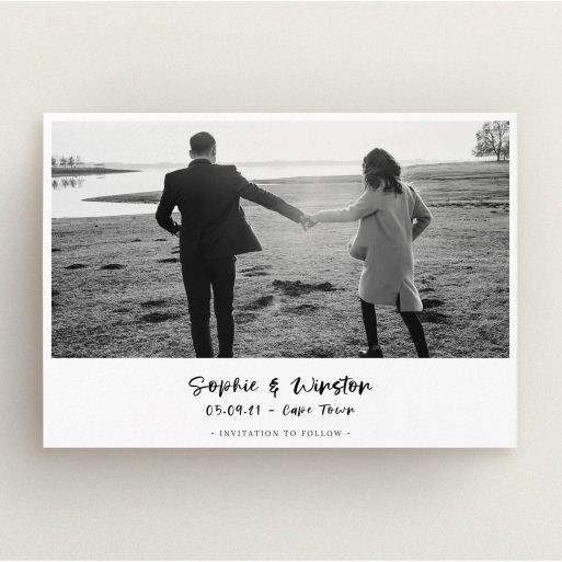 A wedding save the date card template titled "Monochrome Photo". It is an A5 card in a landscape orientation. It is a photographic wedding save the date card with room for 1 photo. "Monochrome Photo" is available as a flat card, with mainly white colouring.