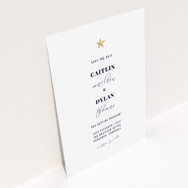 A wedding save the date card named "North Star". It is an A6 card in a portrait orientation. "North Star" is available as a flat card, with tones of white and gold.