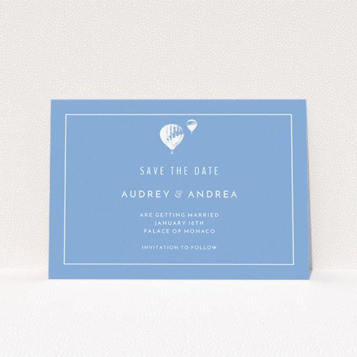 A wedding save the date card design named "Off and away". It is an A5 card in a landscape orientation. "Off and away" is available as a flat card, with tones of blue and white.