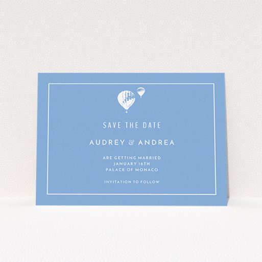 A wedding save the date card named "Off and away". It is an A6 card in a landscape orientation. "Off and away" is available as a flat card, with tones of blue and white.