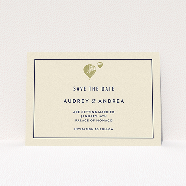 A wedding save the date card design titled "Off and away". It is an A6 card in a landscape orientation. "Off and away" is available as a flat card, with tones of cream and gold.