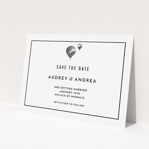 A wedding save the date card design named 'Off and away'. It is an A6 card in a landscape orientation. 'Off and away' is available as a flat card, with mainly white colouring.