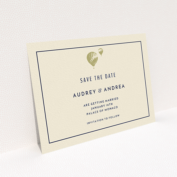A wedding save the date card design titled "Off and away". It is an A6 card in a landscape orientation. "Off and away" is available as a flat card, with tones of cream and gold.