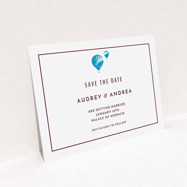 A wedding save the date card named "Off and away". It is an A6 card in a landscape orientation. "Off and away" is available as a flat card, with tones of white and blue.