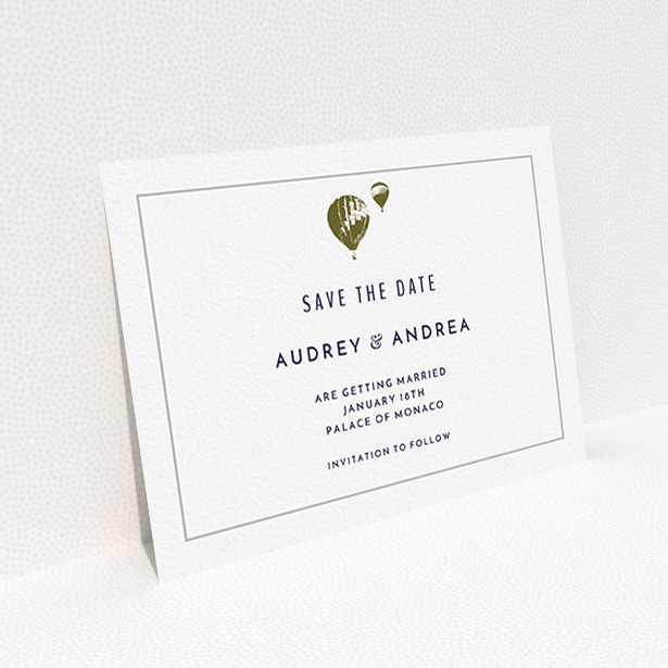 A wedding save the date card called "Off and away". It is an A6 card in a landscape orientation. "Off and away" is available as a flat card, with mainly white colouring.