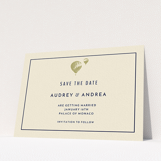 A wedding save the date card design titled "Off and away". It is an A6 card in a landscape orientation. "Off and away" is available as a flat card, with tones of cream and gold.