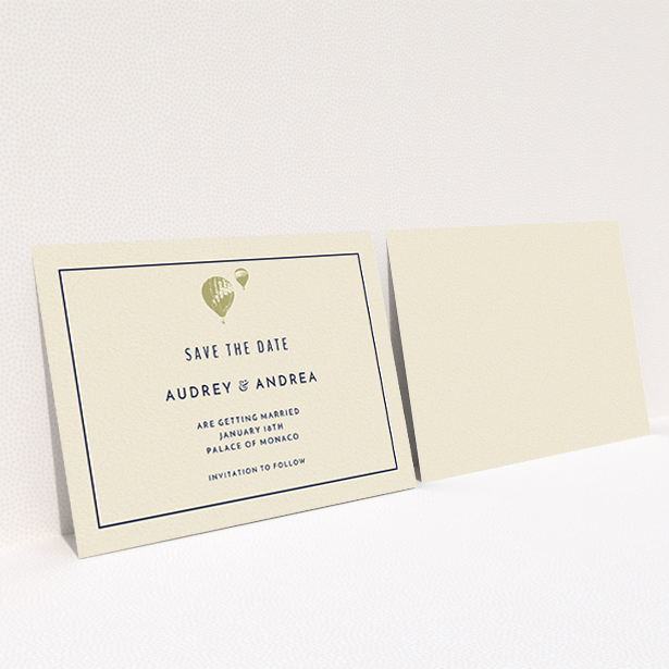 A wedding save the date card design titled "Off and away". It is an A6 card in a landscape orientation. "Off and away" is available as a flat card, with tones of cream and gold.