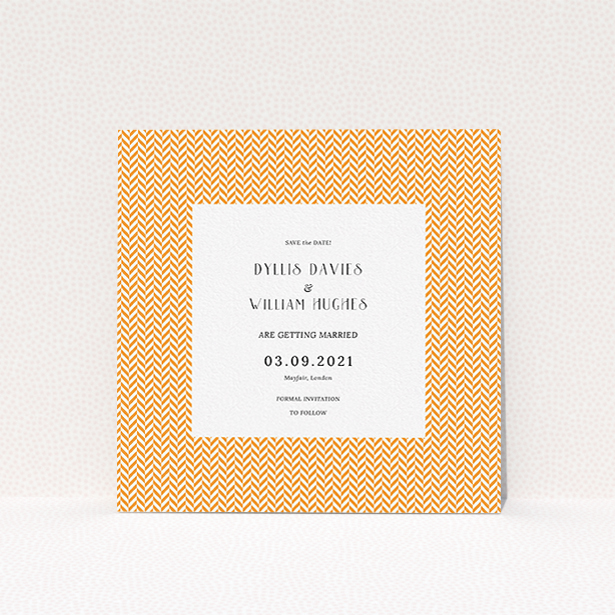 A wedding save the date card design called "Orange Houndstooth". It is a square (148mm x 148mm) card in a square orientation. "Orange Houndstooth" is available as a flat card, with tones of orange and white.