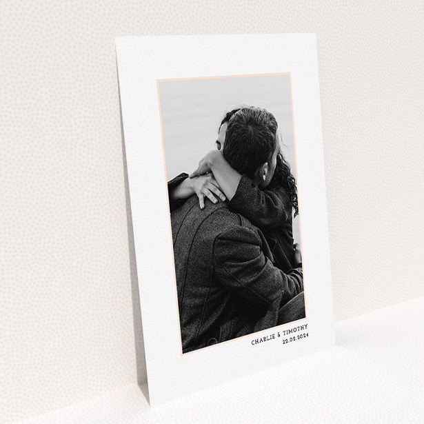 A wedding save the date card design named "Photo Centre". It is an A5 card in a portrait orientation. It is a photographic wedding save the date card with room for 1 photo. "Photo Centre" is available as a flat card, with tones of white and Pink.