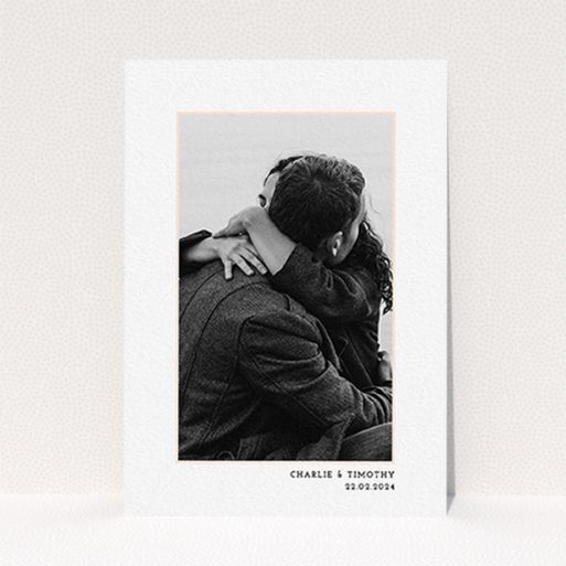 A wedding save the date card called "Photo Centre". It is an A6 card in a portrait orientation. It is a photographic wedding save the date card with room for 1 photo. "Photo Centre" is available as a flat card, with tones of white and Pink.