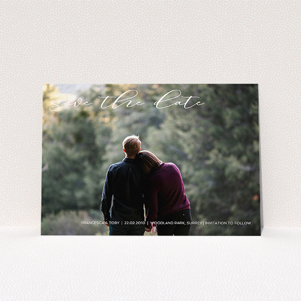 A wedding save the date card called "Photo Freedom". It is an A5 card in a landscape orientation. It is a photographic wedding save the date card with room for 1 photo. "Photo Freedom" is available as a flat card, with mainly white colouring.