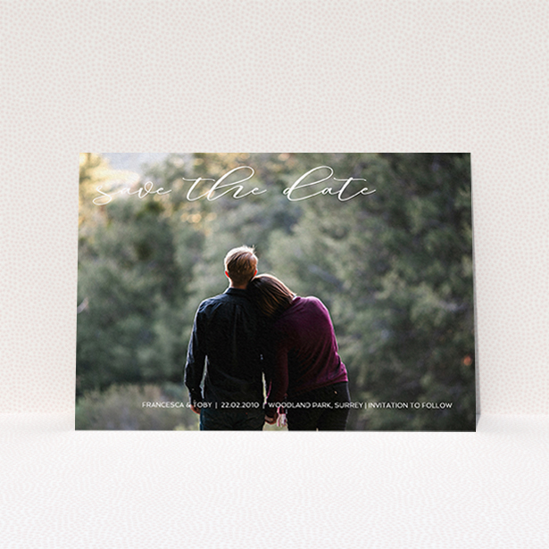 A wedding save the date card called "Photo Freedom". It is an A6 card in a landscape orientation. It is a photographic wedding save the date card with room for 1 photo. "Photo Freedom" is available as a flat card, with mainly white colouring.