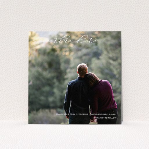 A wedding save the date card template titled "Photo Freedom". It is a square (148mm x 148mm) card in a square orientation. It is a photographic wedding save the date card with room for 1 photo. "Photo Freedom" is available as a flat card, with mainly white colouring.