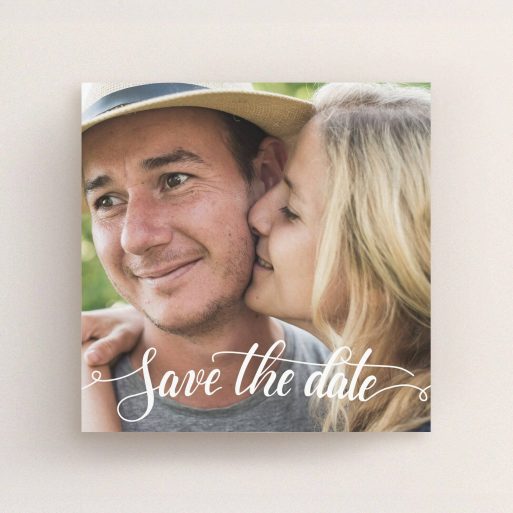 A wedding save the date card design named "Photo Typography". It is a square (148mm x 148mm) card in a square orientation. It is a photographic wedding save the date card with room for 1 photo. "Photo Typography" is available as a flat card, with mainly white colouring.