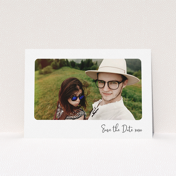 A wedding save the date card called "Rounded Landscape Photo". It is an A5 card in a landscape orientation. It is a photographic wedding save the date card with room for 1 photo. "Rounded Landscape Photo" is available as a flat card, with mainly white colouring.